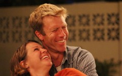 A couple in a healthy relationship smiling and laughing together.