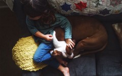 A kid waiting for her parent on a date.