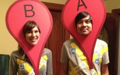 A couple dressed up like Google location finder.