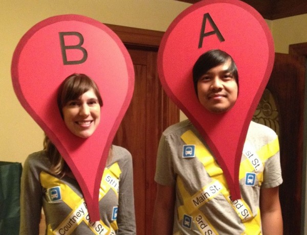 A couple dressed up like Google location finder.