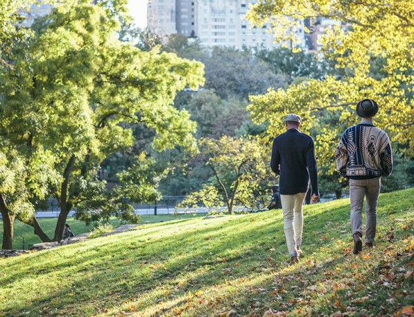 Two LGBT daters on a date in a park.