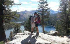 A couple kissing on a hike because it was a cheap first date idea for them.