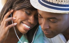 A couple listening to music together.