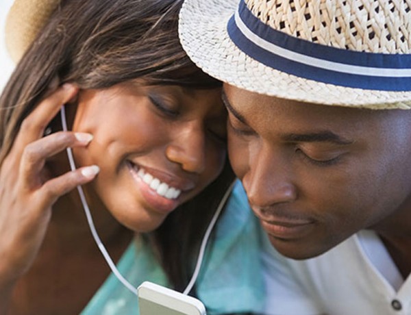 A couple listening to music together.