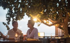 A couple on a date about to get the bill and wondering who should pay.