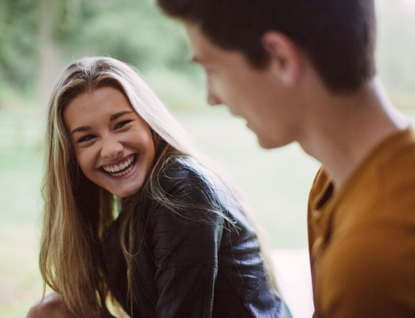 A girl flirting with a guy who is nervous and shy.