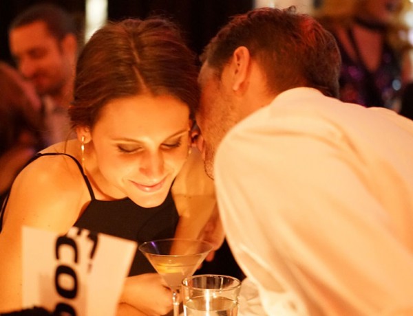 A man thinking of having an affair talking to a woman at a bar.