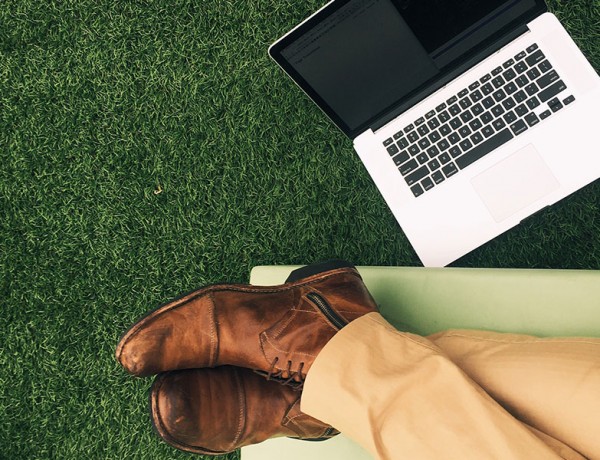 A man relaxing with his computer after writing the best online dating profile.