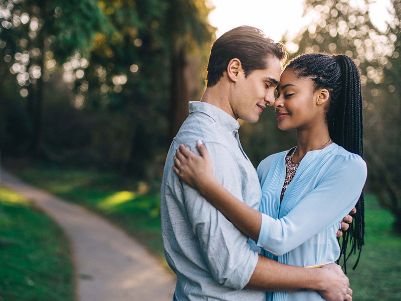 A woman hugging a man and wondering if she's accidentally clingy.