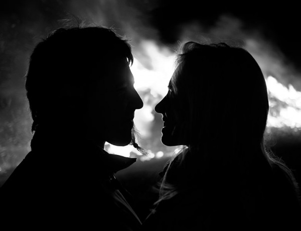 A black and white photo of a couple in a relationship that one of them suspects is fake.