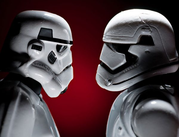 Two stormtroopers looking at each other as if in love.