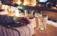 A man at a bar about to have a drink.