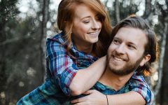 A couple who were friends before having a relationship laughing together.