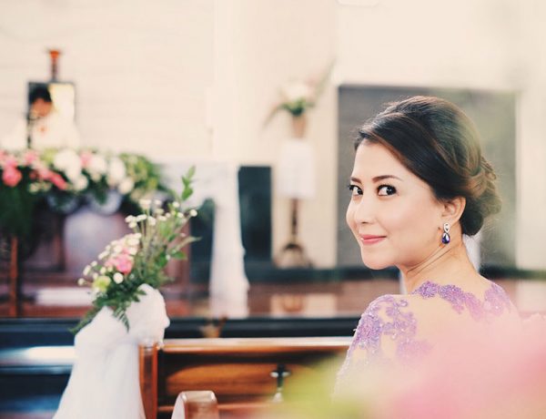 A bridesmaid at a wedding wishing she could be the bride.