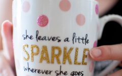 A woman drinking a coffee cup with of of our online dating profile quotes on it.