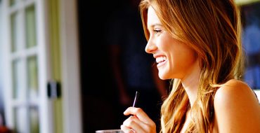 A woman who's single and 30 having a drink.