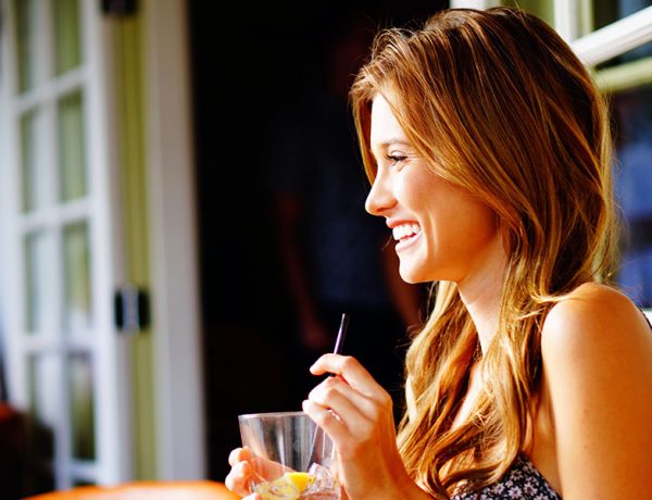 A woman who's single and 30 having a drink.