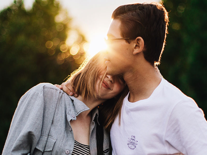 A woman showing a man she loves him using one of these 50 ways to say you love someone.