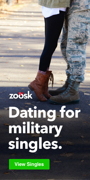 A military couple kissing.
