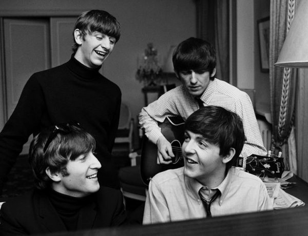 The Beatles sitting around together writing one of the best Beatles love songs.