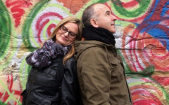 A couple dating at 50, leaning against each other and smiling.