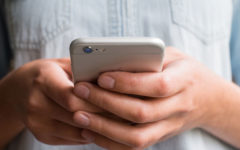 A woman responding to one of these Tinder openers and Tinder icebreakers and flirting and laughing with the guy she's talking to.