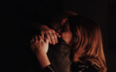 A woman who keeps seeking out dysfunctional relationships hugging the man she's with tightly.