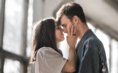 A girl kissing her date and wondering how many dates before it's a relationship.