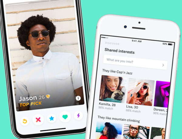 A picture of OkCupid vs. Tinder: the two apps on phones next to each other.