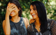 A woman dating over 50 laughing with her adult child.