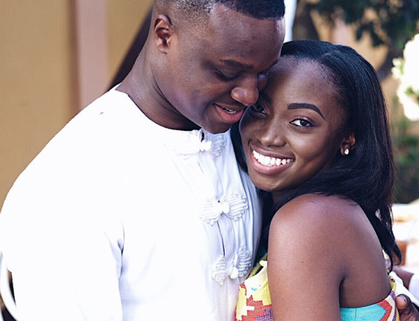 A man who learned how to woo a woman, hugging her and smiling and she looks up and smiles while hugging him back.