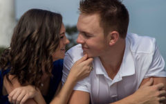 A woman who used these flirty quotes for him smiling into her boyfriends eyes and laughing.