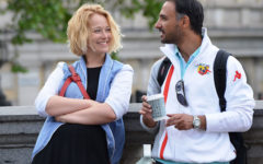 A woman who learned how to start a conversation with someone, chatting with a man she’s attracted to outside.