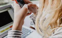 A woman using these dating profile tips to update her profile.