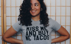 A girl smiling and waiting for a guy to figure out "should I ask her out?"