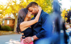 A woman who's trying to deal with emotionally unavailable men, hugging her boyfriend and caressing his face.