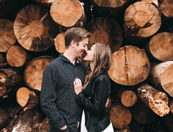 A woman who things chivalry is not dead kissing her boyfriend outside.