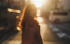 Someone getting through a divorce while still in love watching their spouse walk away in a crowded street.