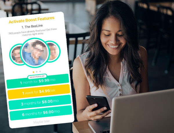 A woman on her phone using Bumble Boost to meet other singles on the Bumble dating app.