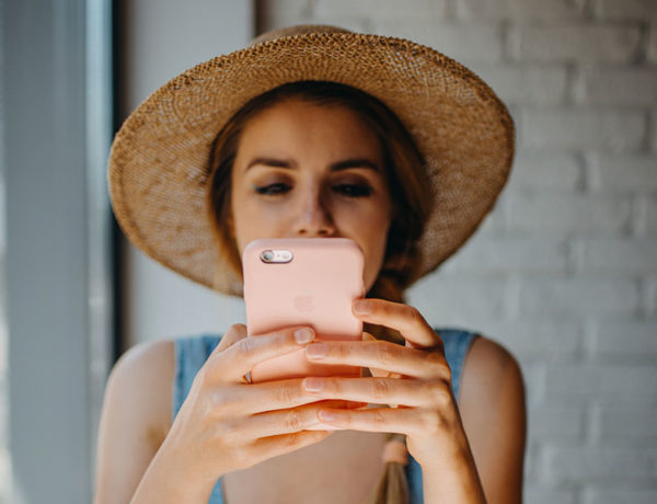 A woman on her phone using one of these Bumble opening lines to start a conversation with a guy on the app.