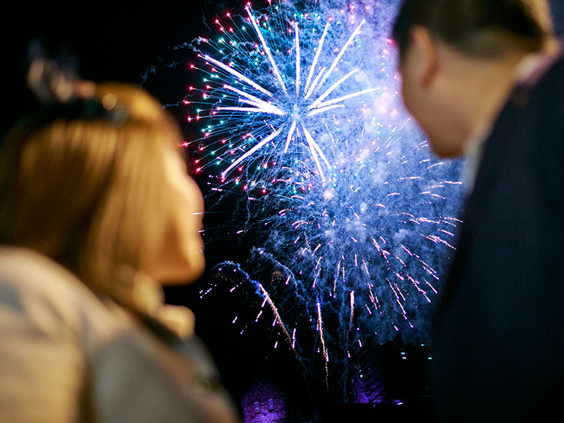 A couple who didn't take bad dating advice, watching the 2019 New Year's fireworks together.