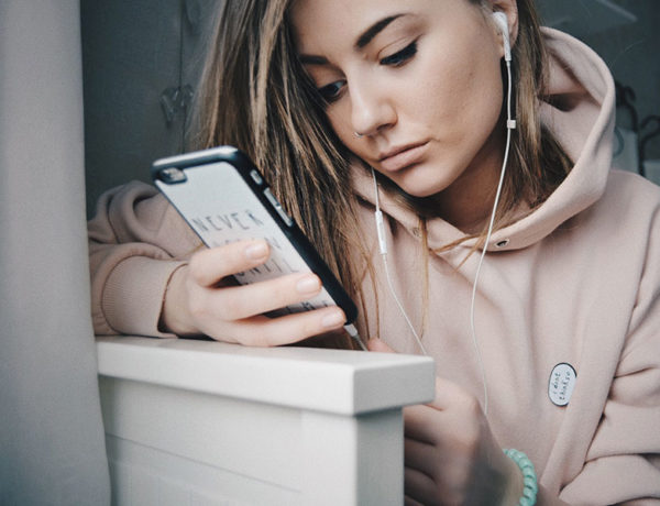 A girl looking through her Tinder matches, upset that she doesn't have any.