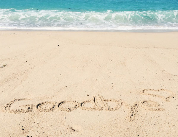 The words goodbye written in the sand on the beach be someone who wanted to know how to get over a guy.