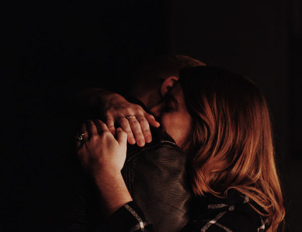 A woman hugging a man after they agree to go on a relationship break.