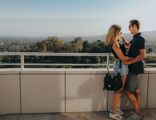 A man who learned how to get your ex back, touching his girlfriend's chin after they had a long talk about getting back together.
