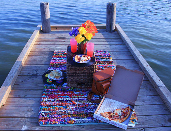 A creative third date idea, for a picnic on a dock.