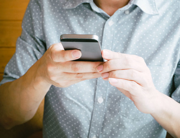 A guy looking for a bumble hookup, on the app texting with someone.