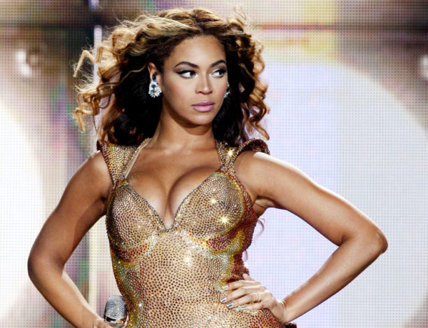 Beyonce on stage looking strong as she sings one of these songs about strong women.