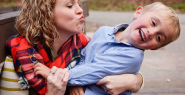 A mom who's learning how singles parents dating do it, trying to kiss her son as he laughs and pulls away.