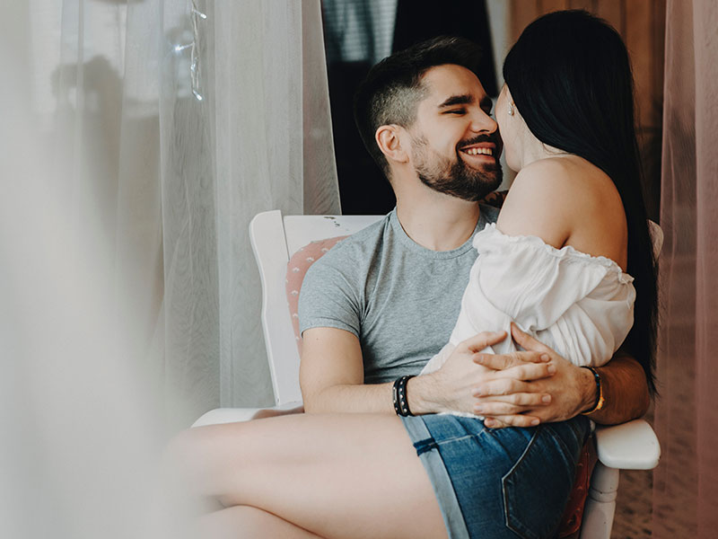 Girl Sitting On Boy Lap